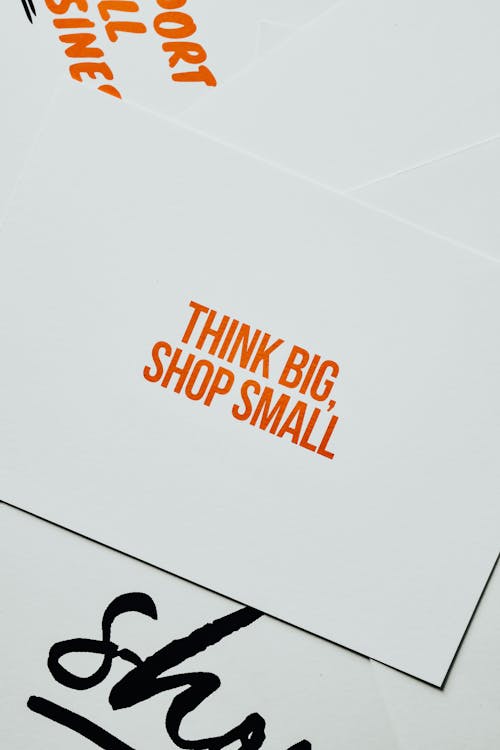 Think Big Shop Small Text on a Paper