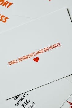 Card with 'Small Businesses Have Big Hearts' message in orange lettering on white background.