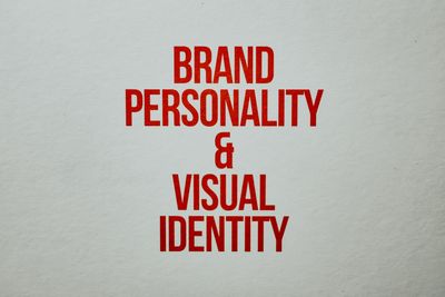 Red text emphasizing brand personality and visual identity on a neutra — Photo by Eva Bronzini on Pexels