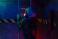 Person In Spacesuit Climbing A Ladder