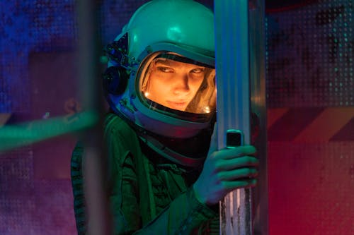 Woman in Green Spacesuit