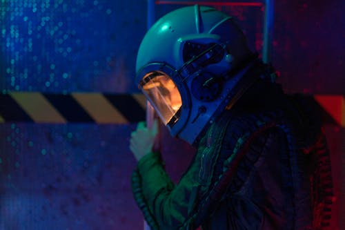 Woman In Spacesuit Sitting On Floor · Free Stock Photo