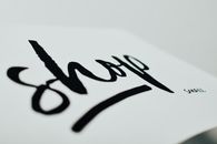 Close-up of a handwritten sign promoting support for small businesses.