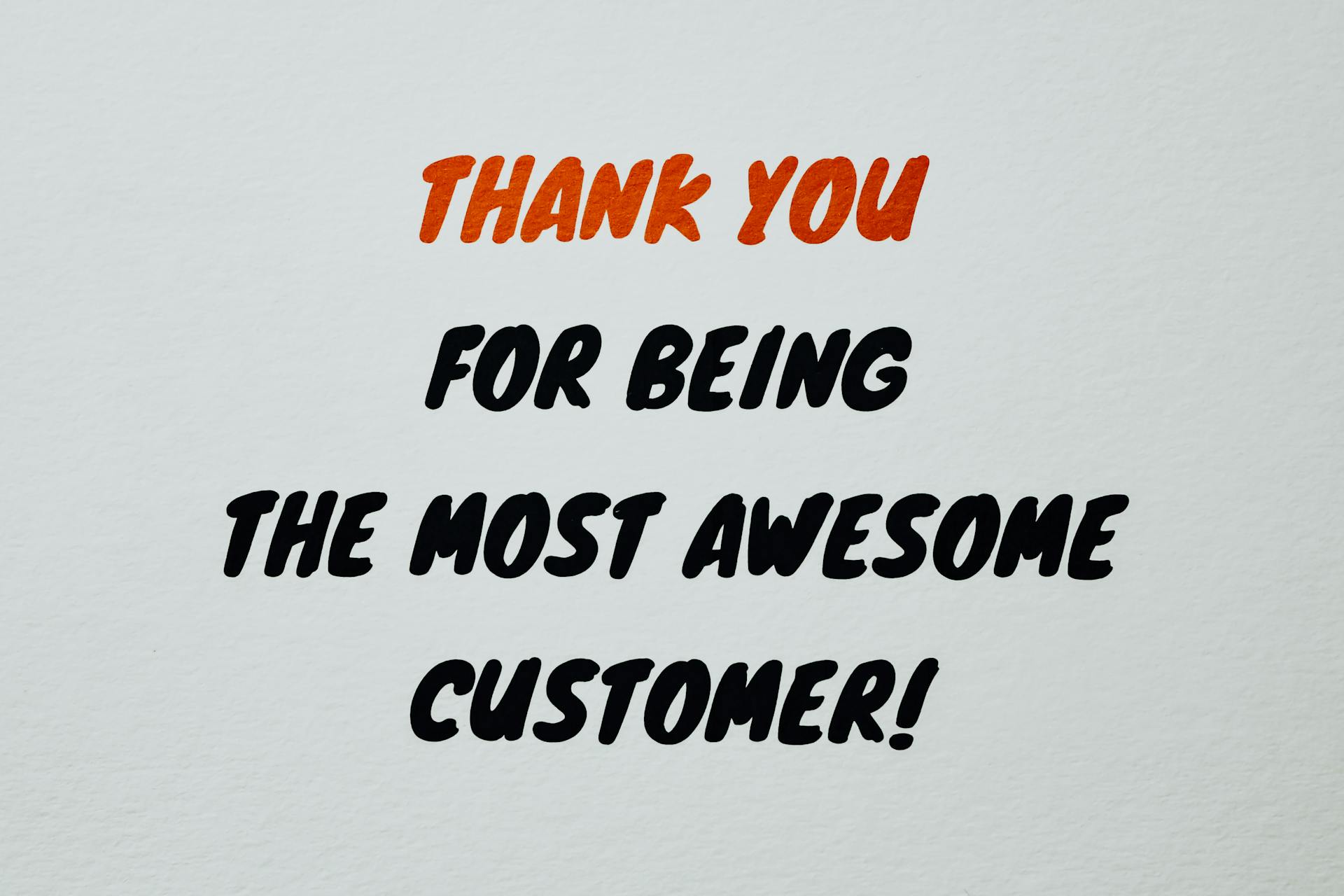 Vibrant thank you message expressing appreciation to customers with artistic typography.