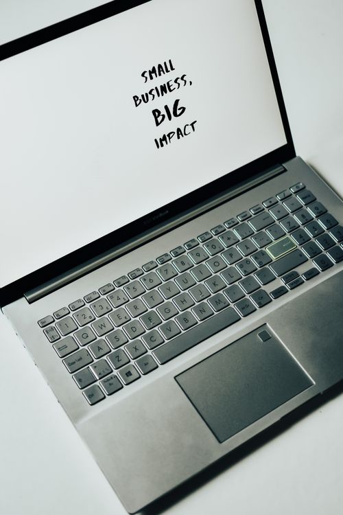 Laptop screen showing Small Business, Big Impact