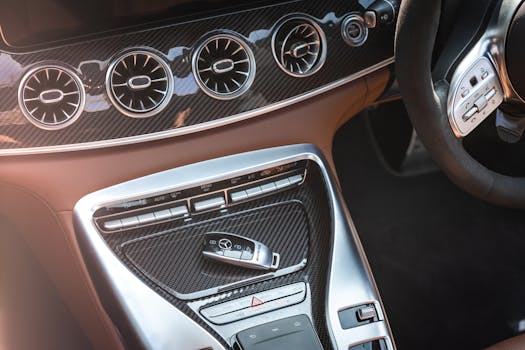 Close-up of a luxury car's center console with key and modern controls.