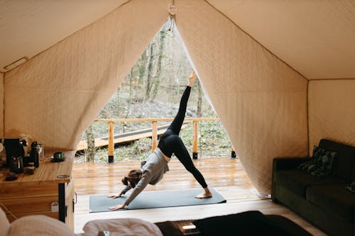 Woman in Activewear Doing Yoga