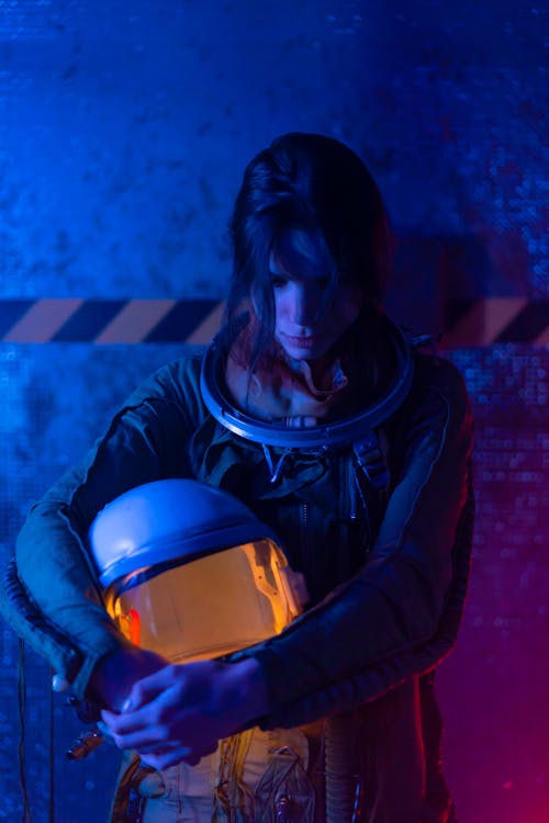 Woman in Blue Spacesuit Looking Tired