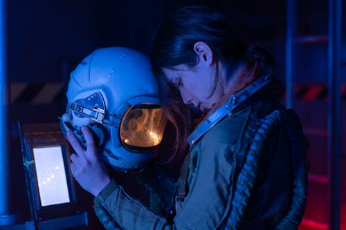 Woman in Spacesuit Looking Tired