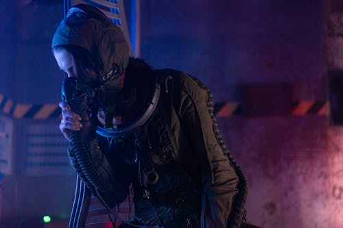 Woman In Spacesuit Breathing Oxygen