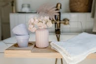 White Ceramic Vase on Brown Wooden Table