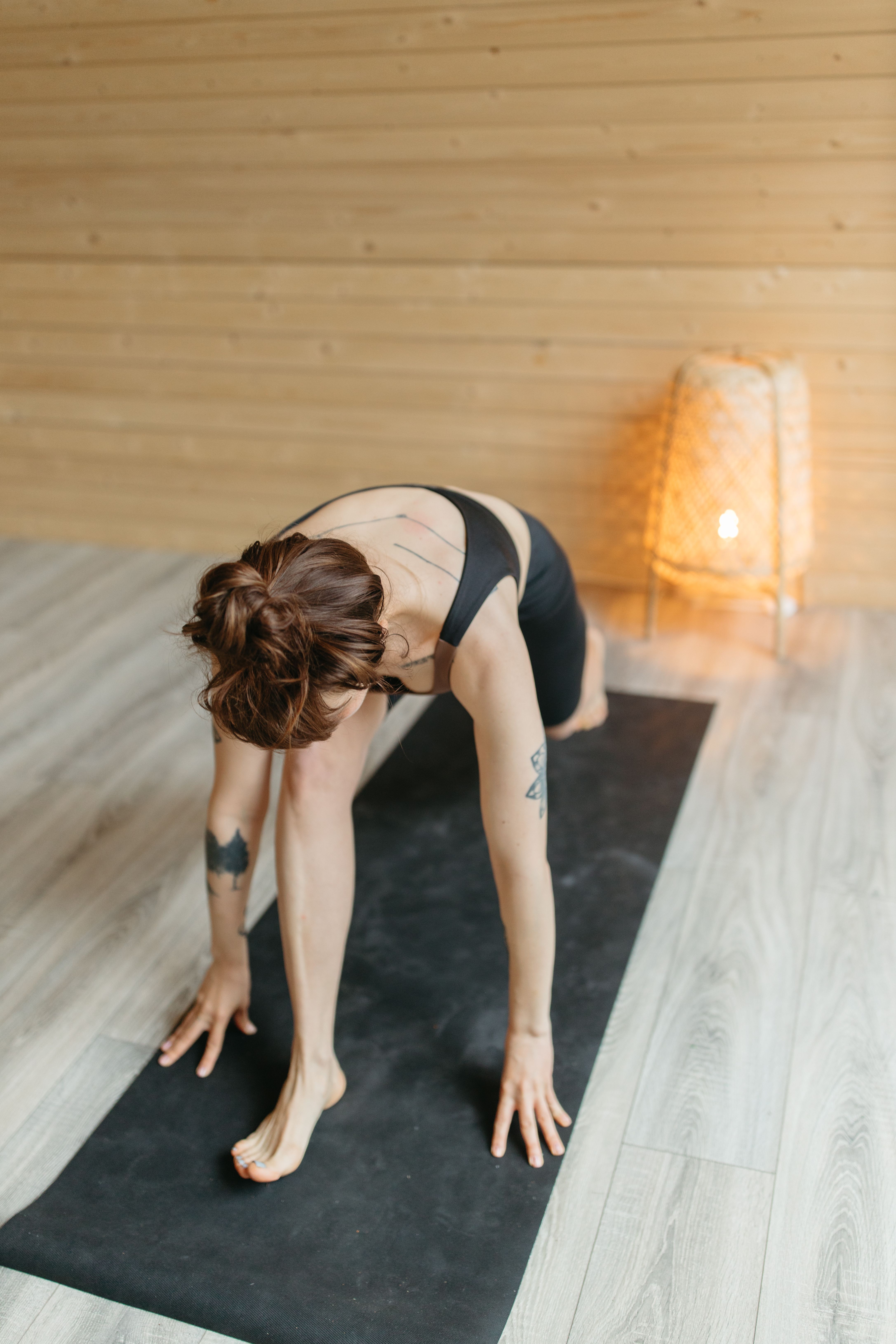 Woman Doing Stretching on Yoga Mat · Free Stock Photo