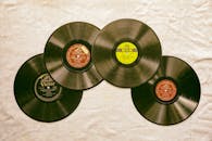 Photo of Vinyl Records on a White Textile