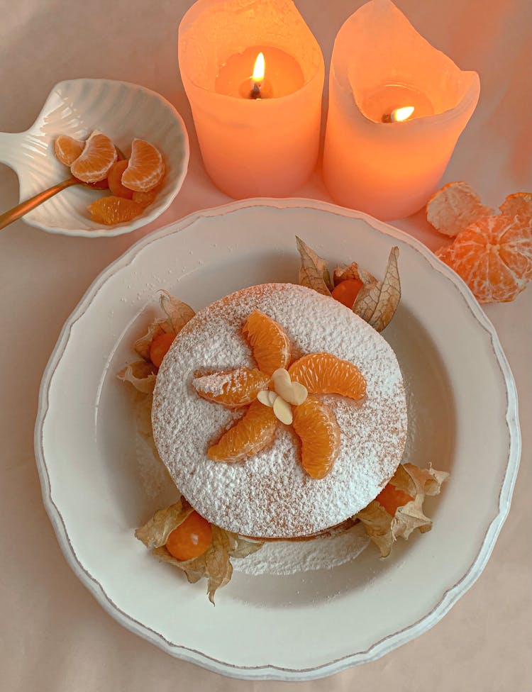 Overhead Shot Of Pancakes With Powdered Sugar With Tangerine S