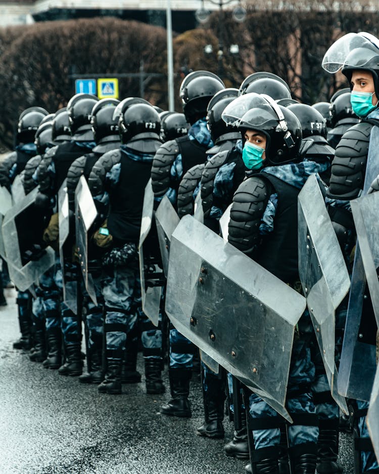 Police Officers With Shields On Street