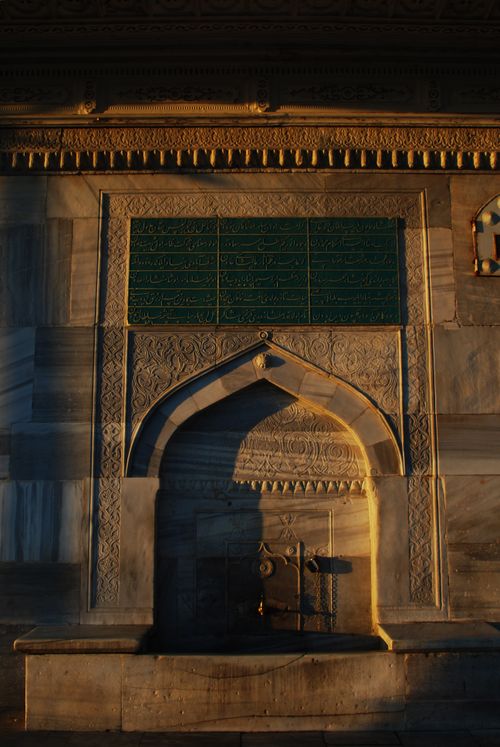 Free Beautiful detailed shot of Islamic architectural details in Istanbul at sunset, showcasing carved stone and calligraphy. Stock Photo