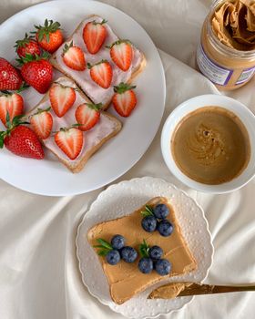 Delicious breakfast spread with strawberry and blueberry toast, perfect for a healthy start to the day.