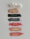 Cosmetic Product Swatches on White Surface