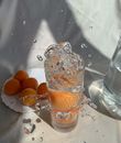 Orange Fruits in Clear Glass Jar