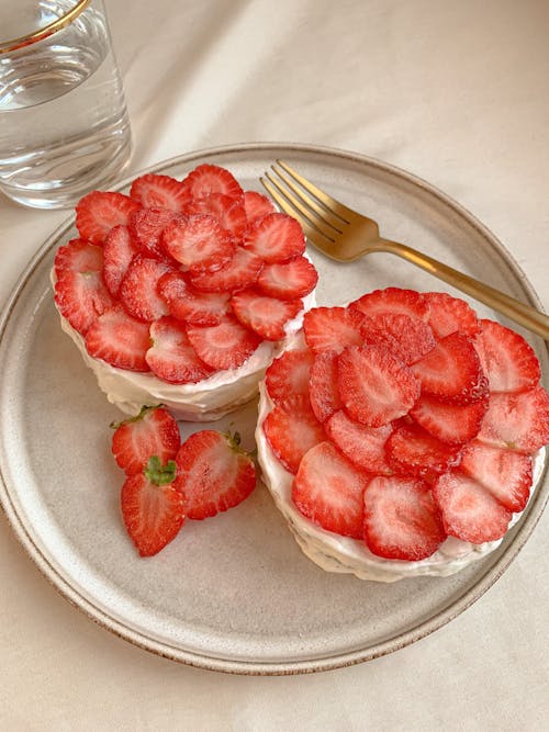 Cake with Cream Topped with Sliced Strawberries