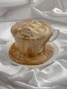 Overflowing Cup of Coffee