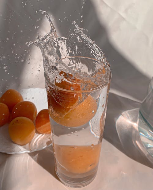 Free Orange Juice in Clear Drinking Glass Stock Photo