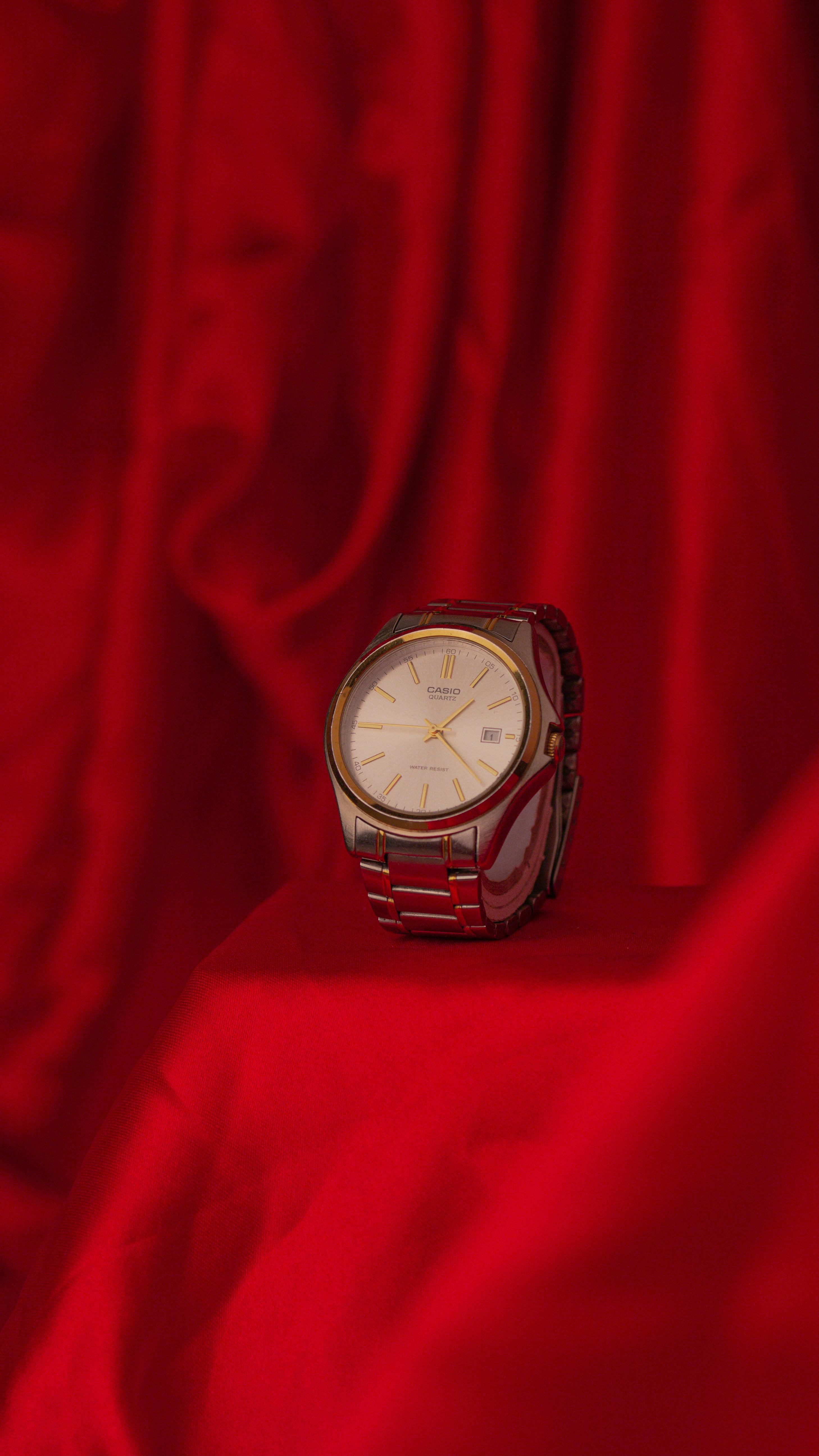 silver and gold round watch