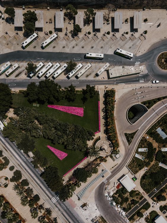 Aerial View of a Bus Terminal Beside the Roadway · Free Stock Photo