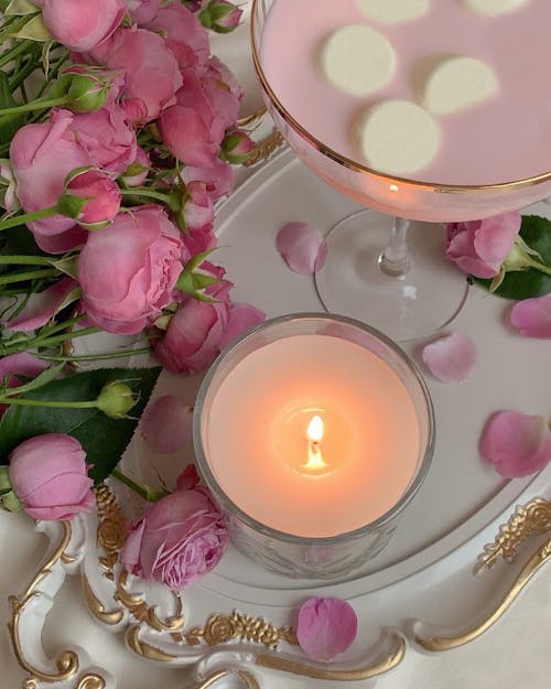 Free Pink Roses Near a Candle Stock Photo