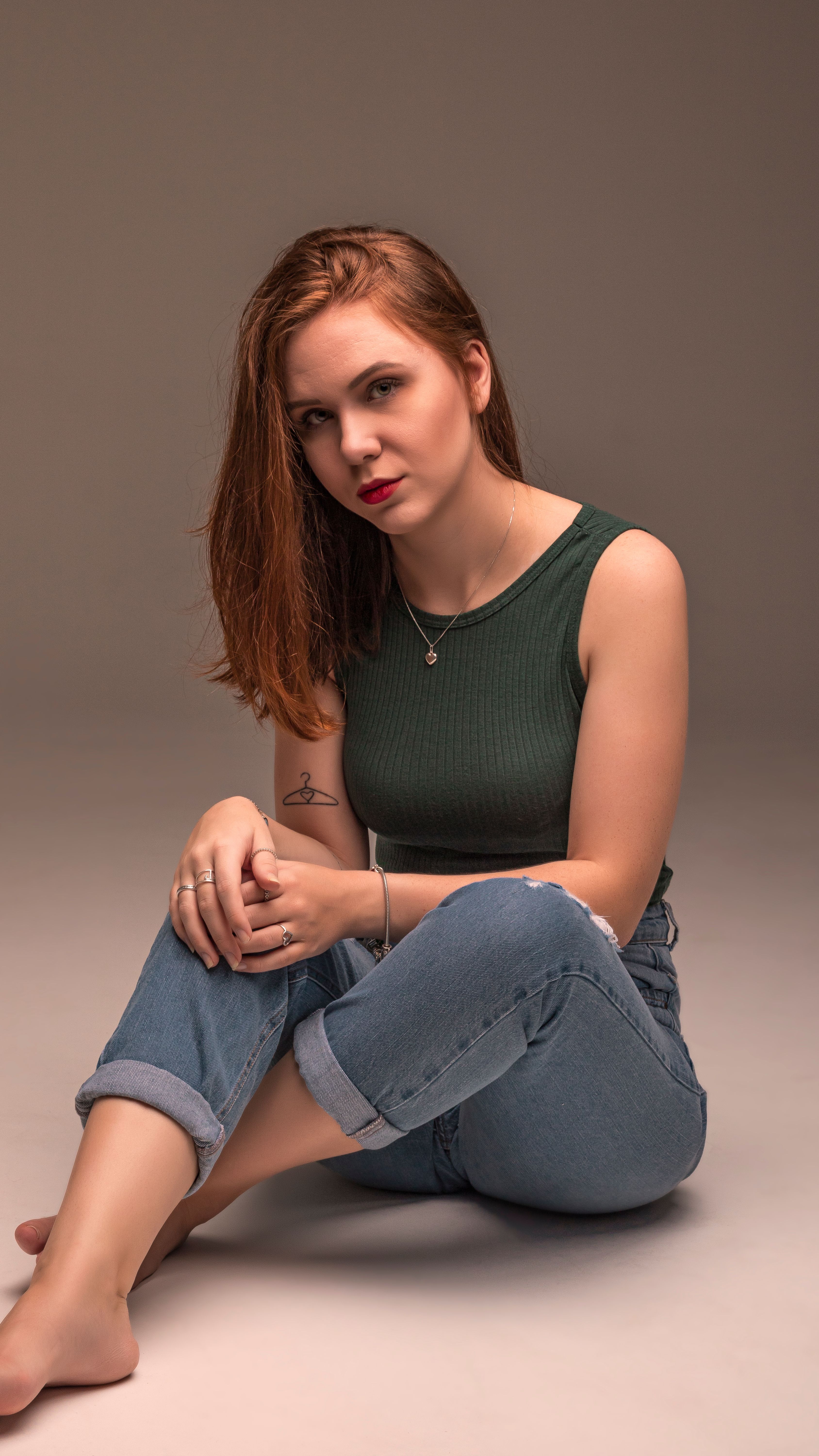 Woman in Green Tank Top and Blue Denim Jeans · Free Stock Photo