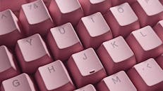 Close-Up Shot of Pink Computer Keyboard