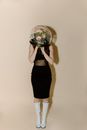 Woman in Black Skirt Holding Round Mirror