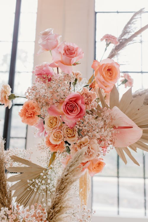 Pink Roses in White Ceramic Vase