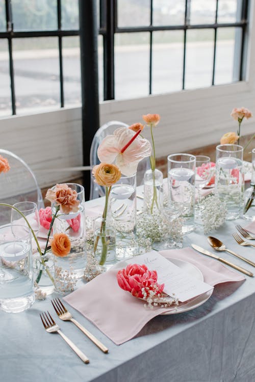 Free Clear Glass Vases on Table Setting  Stock Photo