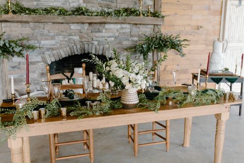 Free Luxurious wedding reception setup with floral arrangements and candles. Stock Photo