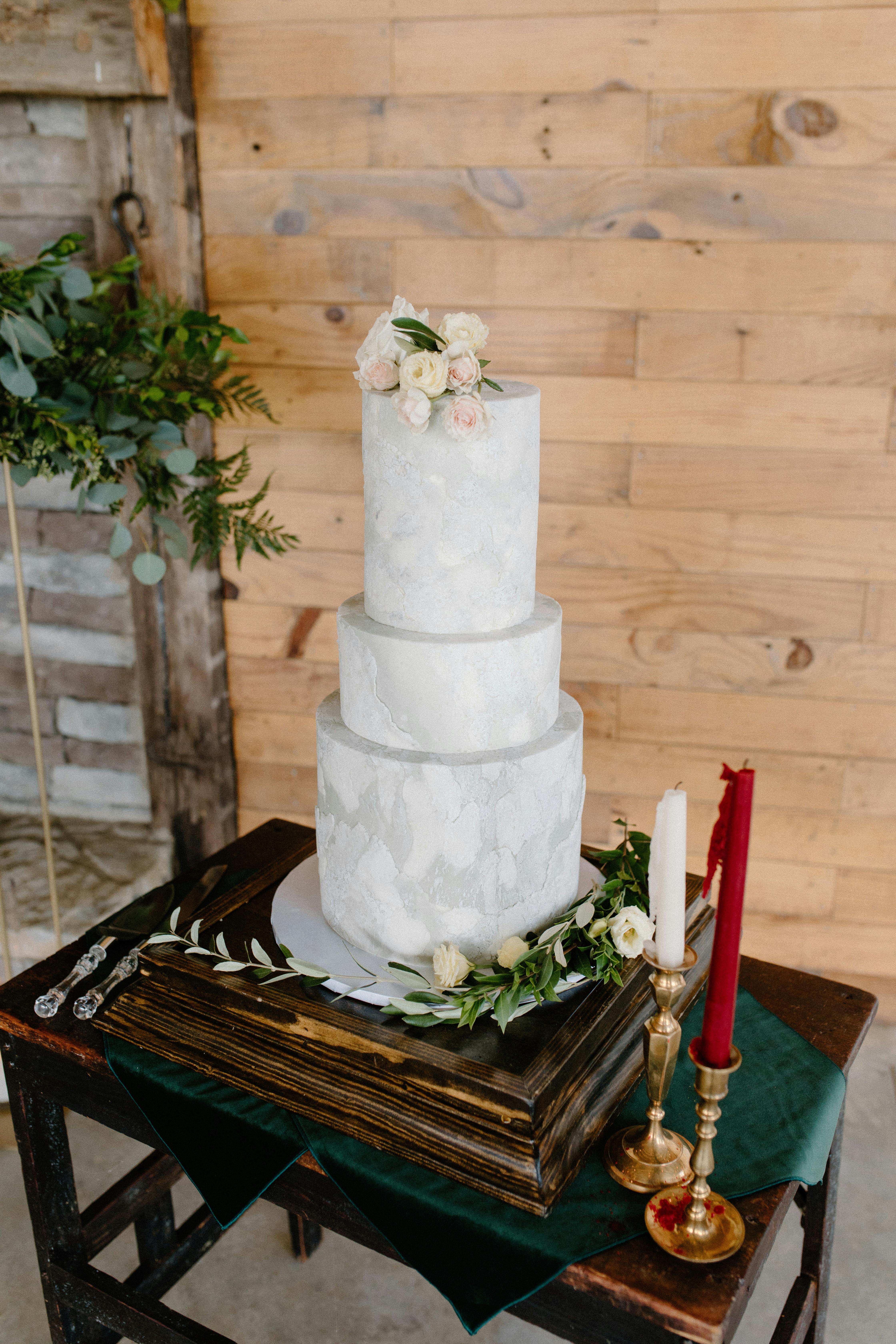 White 3 Tier Cake on Brown Wooden Table