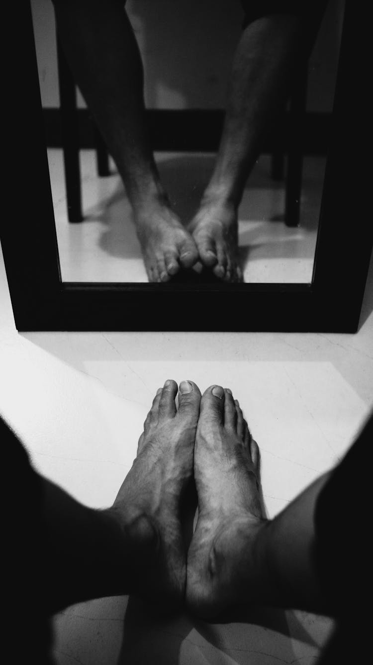 Man Feet In Mirror