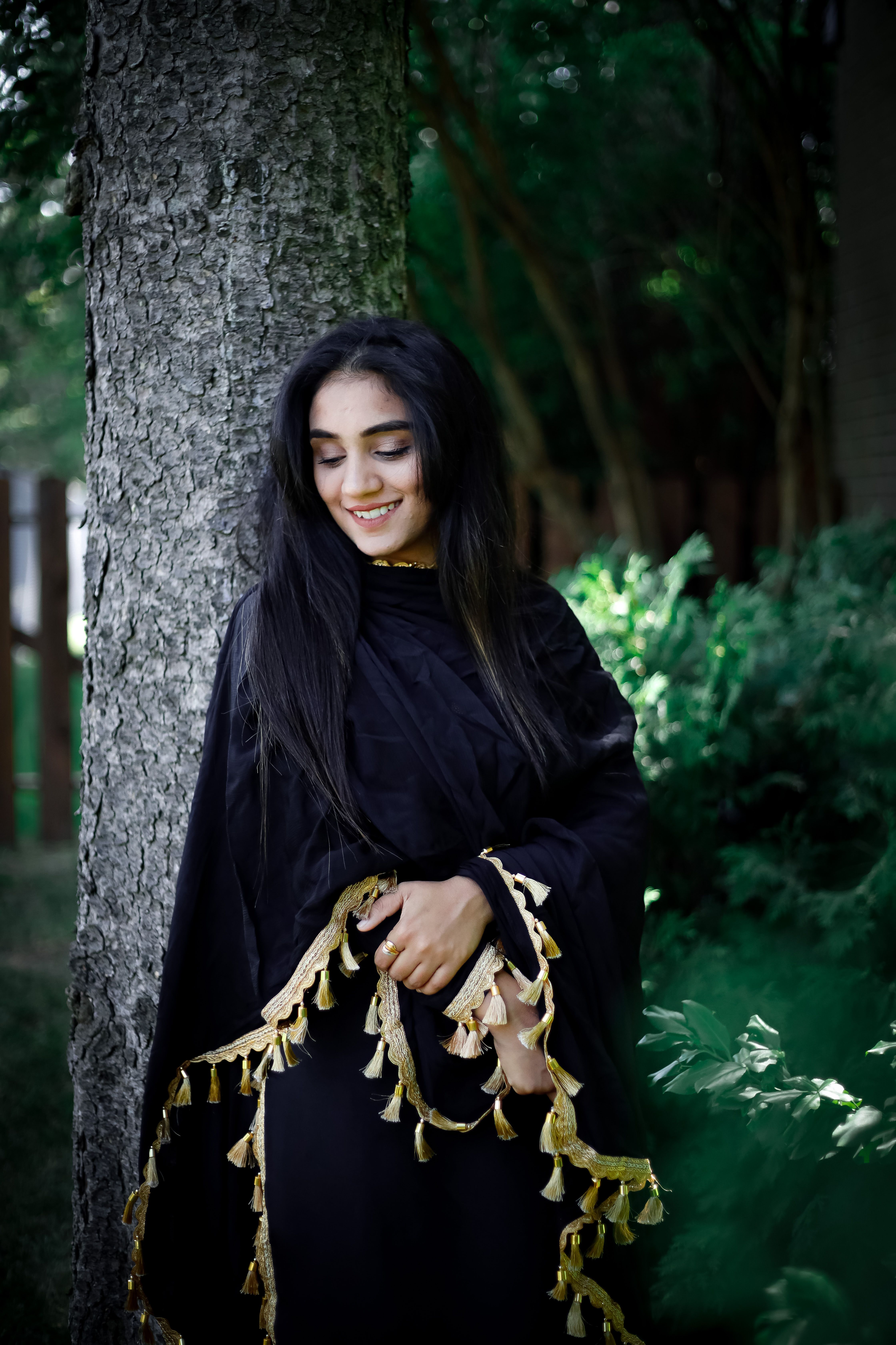 Smiling Woman Posing under Tree · Free Stock Photo