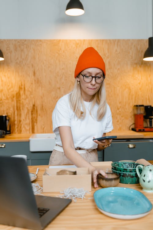 A Woman Packaging Crockeries