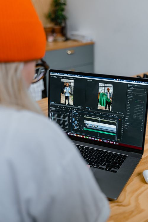 A Man Sitting on Front of the Computer while Editing Video · Free Stock ...