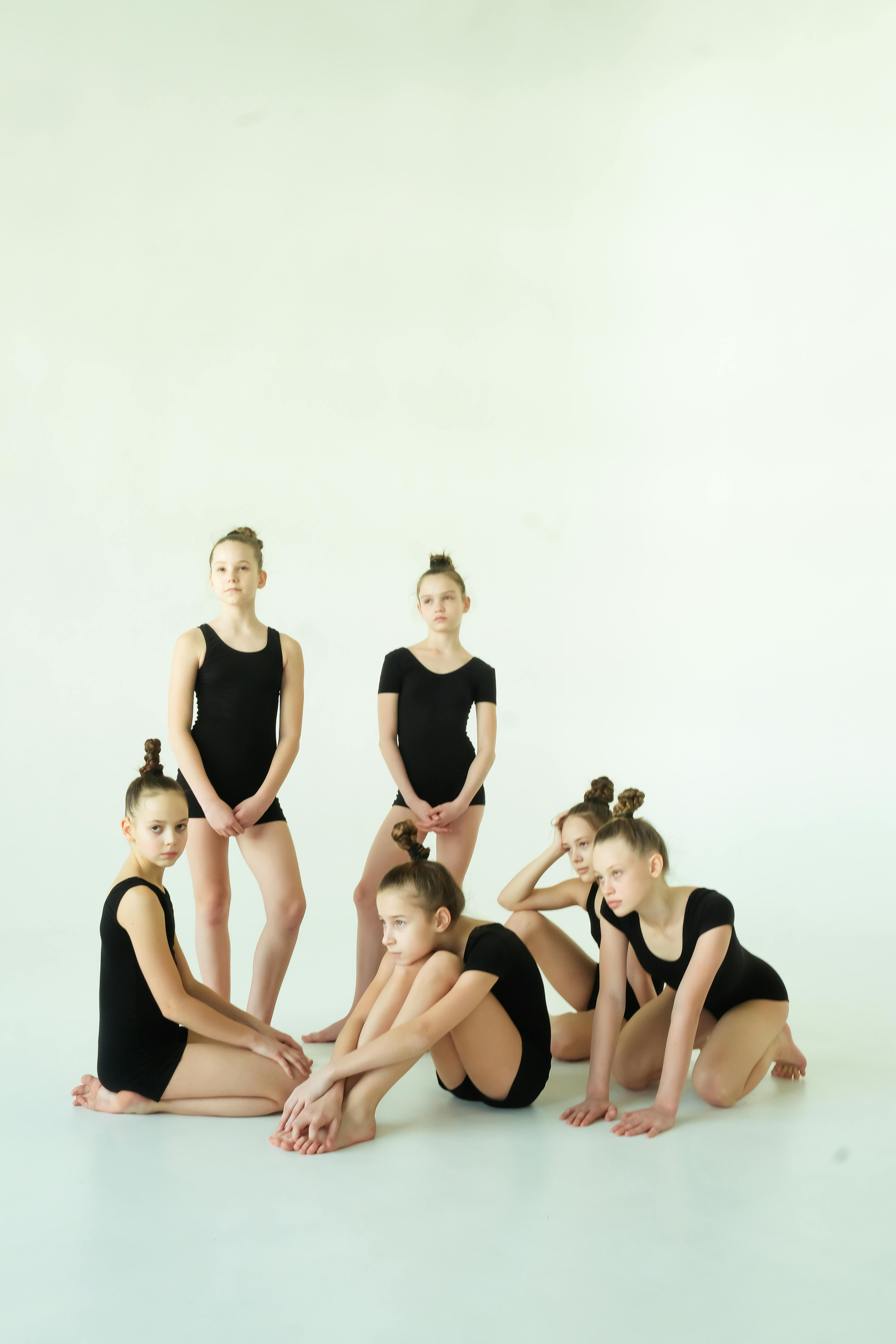 The group of modern ballet dancers posing on gray background Stock Photo -  Alamy