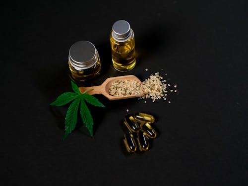 Photo of Marijuana Stuffs on Dark Background