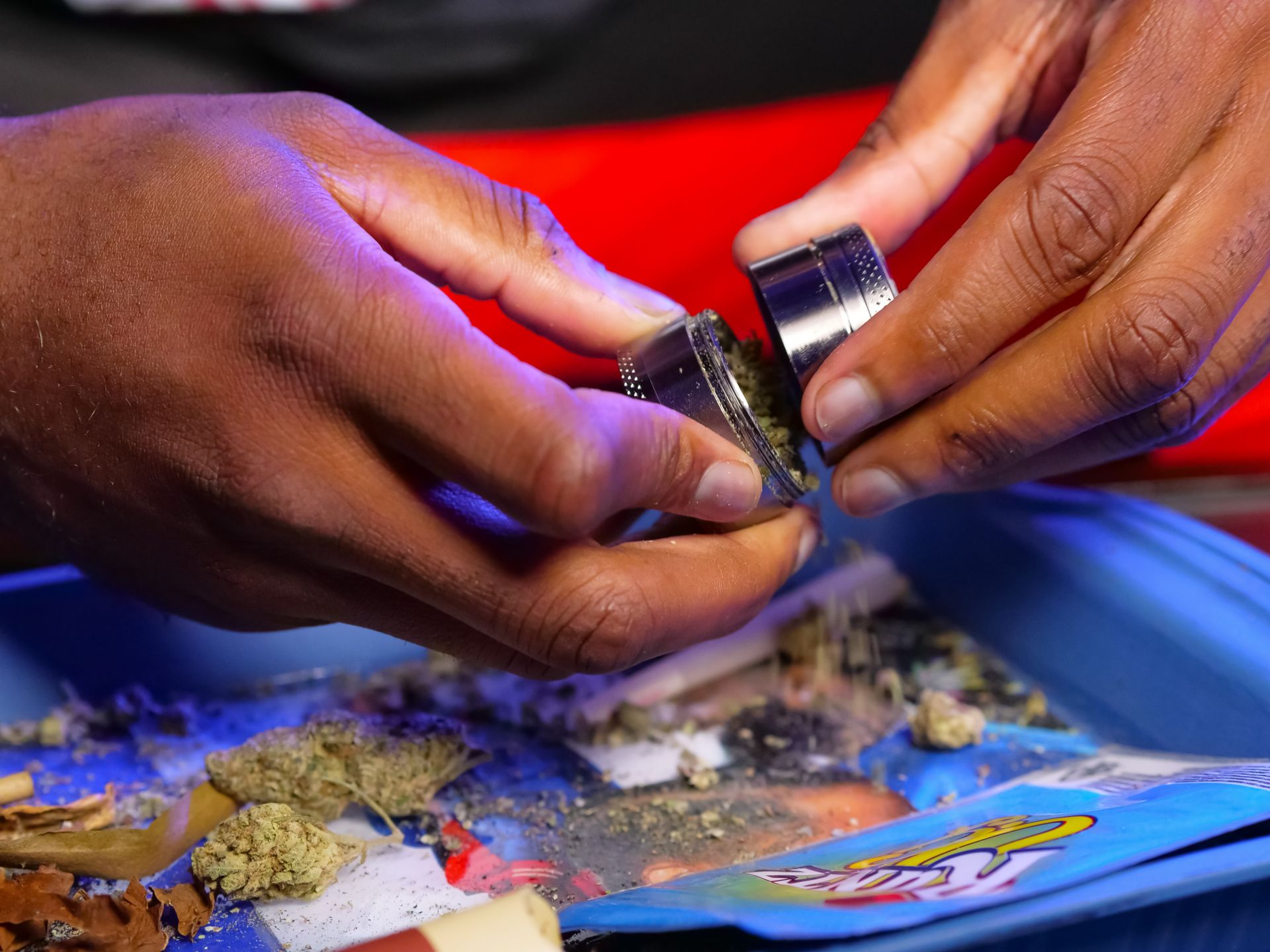 Close-Up Photo of Grinding Weed