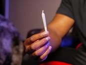 Photo of Person Holding Blunt Made of Weed