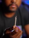 Photo of Person Holding Joint Made of Weed