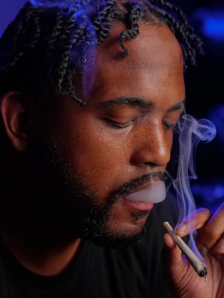 Close-Up Photo Of Man Smoking Blunt