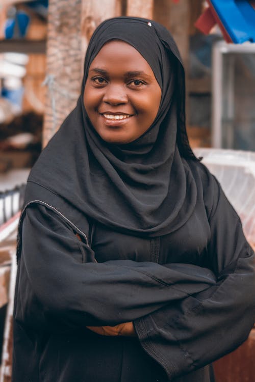 A Woman in Black Hijab Smiling