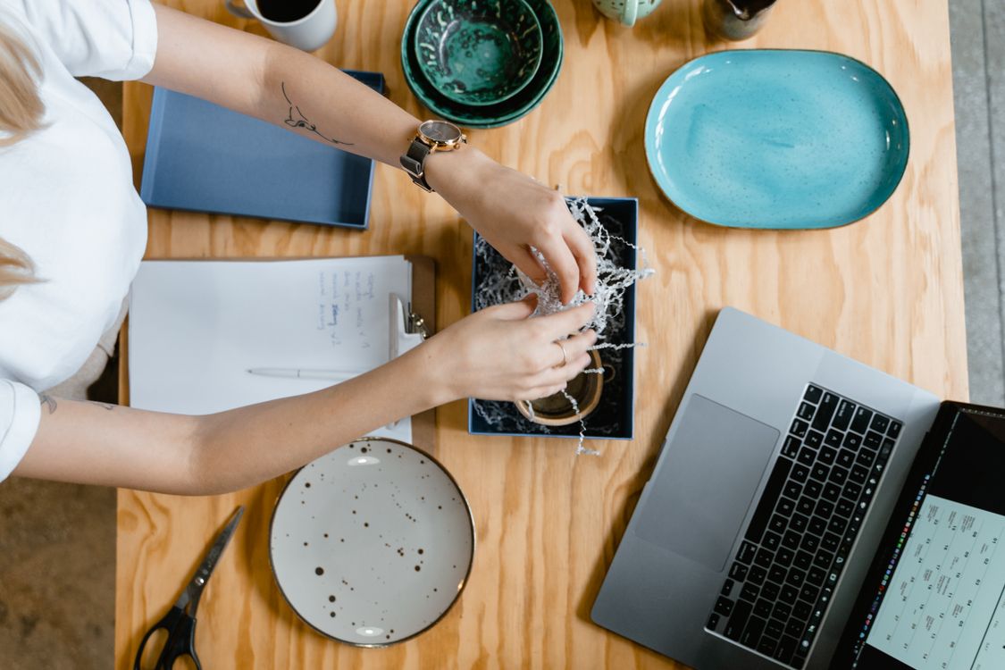 Woman Using a Laptop and a Notepad to Make Craft Project · Free Stock Photo