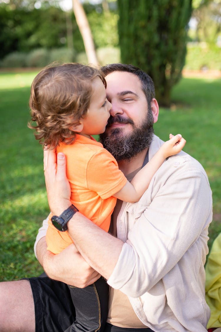 Bearded Man Hugging A Boy