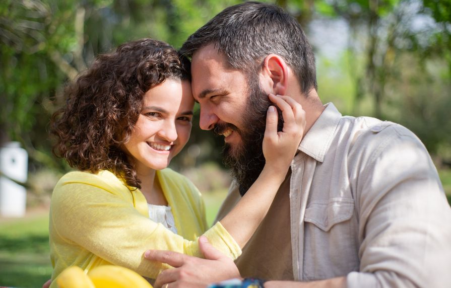Couple enjoying coffee together during an online date meeting